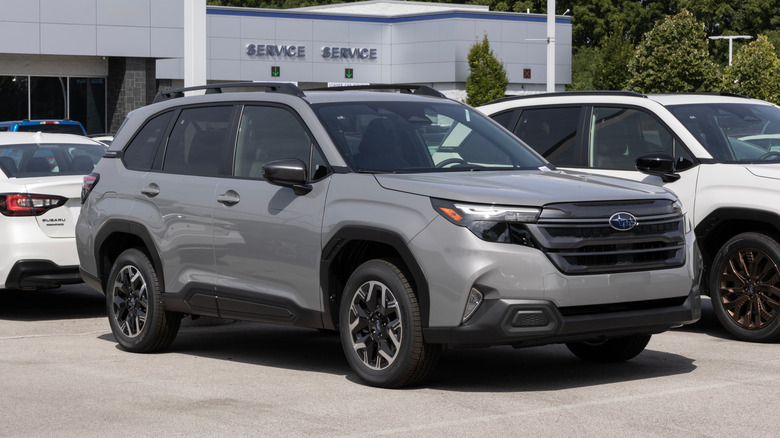 A Subaru Forester Premium Compact SUV at a dealership.