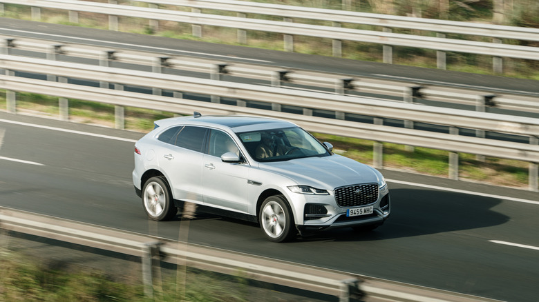 A Jaguar F-Pace driving on a highway