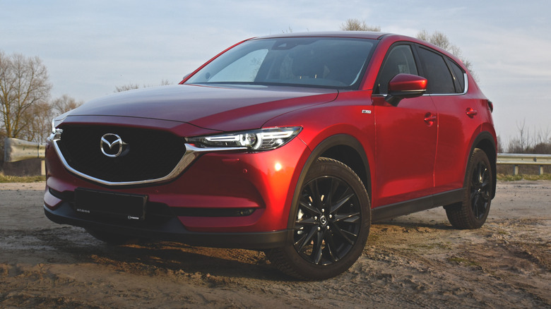 Red Mazda CX-5 (KF) Black Edition 2018 parked on the curb of a country road