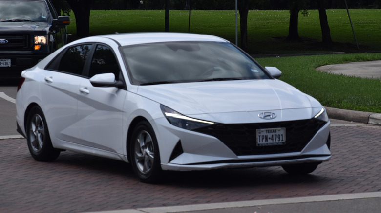 A white Hyundai Elantra near a nature reserve