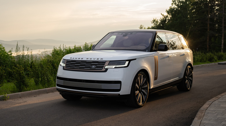 White Land Rover Range Rover L460 driving down the road.