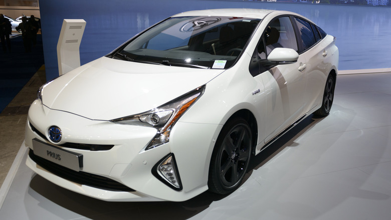 A white 2017 Toyota Prius on display at a car show