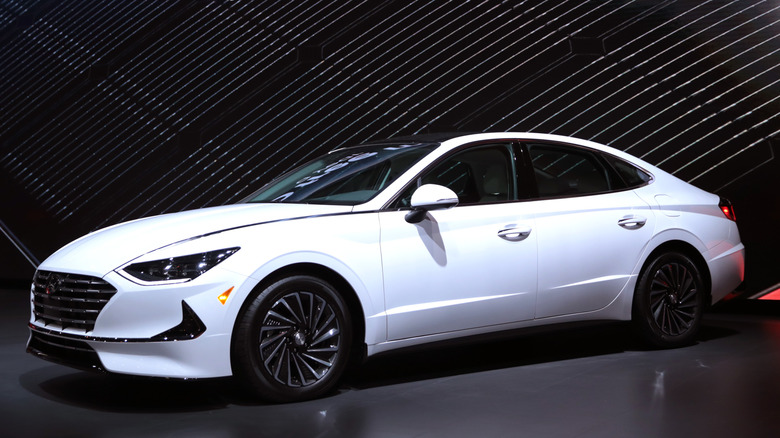White Hyundai Sonata Hybrid on display.
