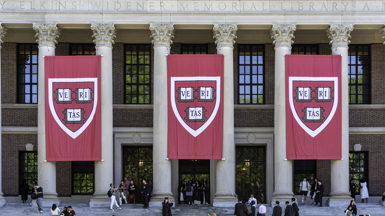 Three huge "Veritas" banners hang from the facade of Widener Memorial Library at Harvard.