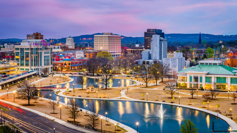 Huntsville, Alabama, USA park and downtown cityscape at twilight.