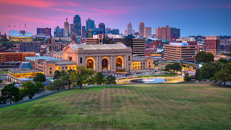 Aerial cityscape image of Kansas City skyline at twilight blue hour.