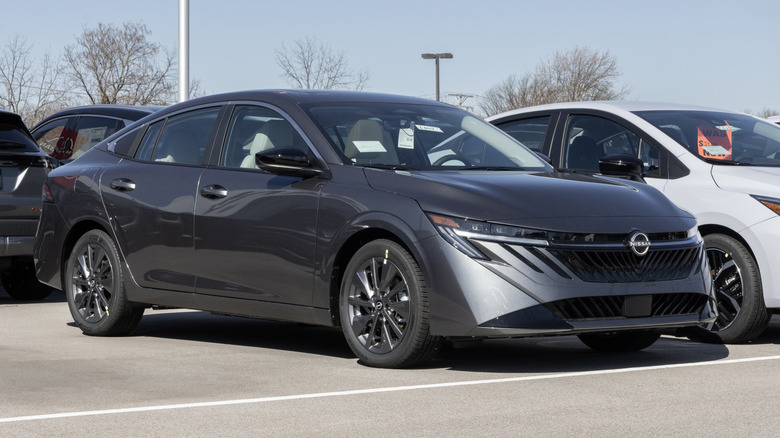 A Nissan Sentra SL Compact Sedan display at a dealership.