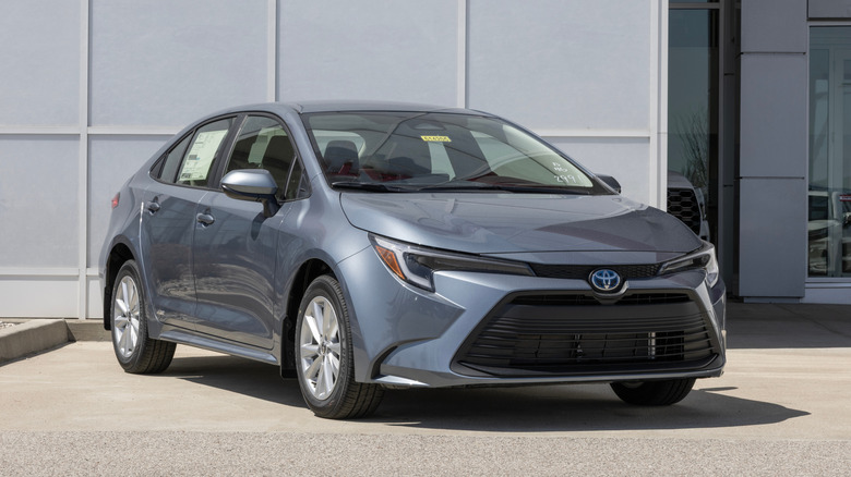 A Toyota Corolla Hybrid LE AWD Sedan at a dealership.