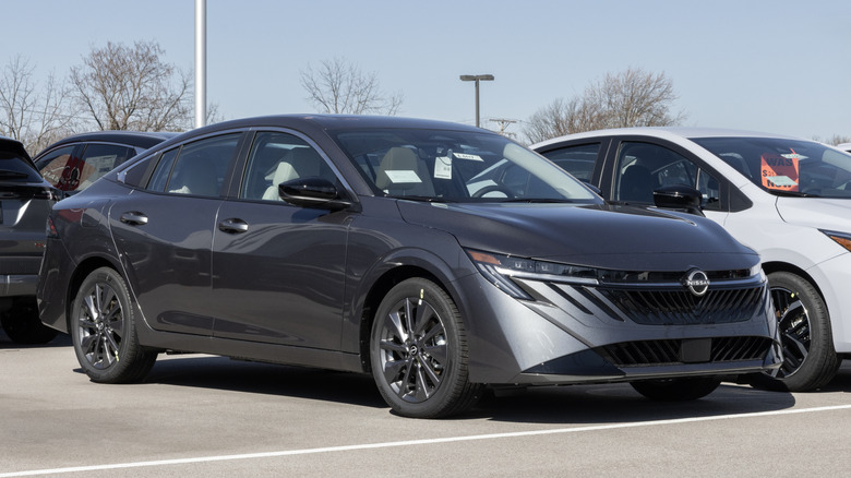 A Nissan Sentra SL Compact Sedan display at a dealership.