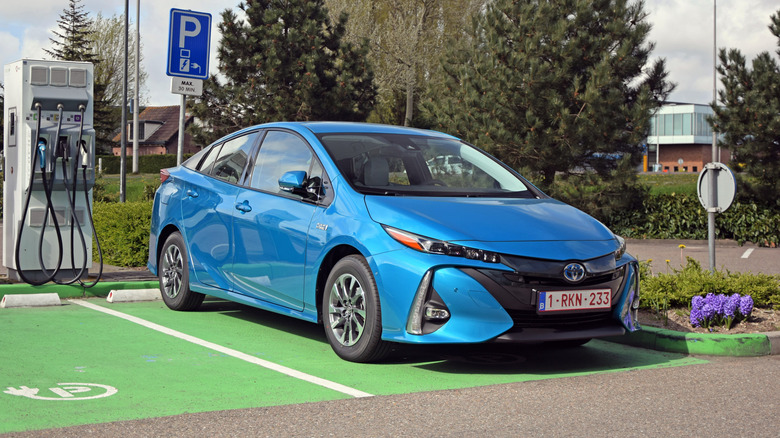 A blue Toyota Prius Prime charging.