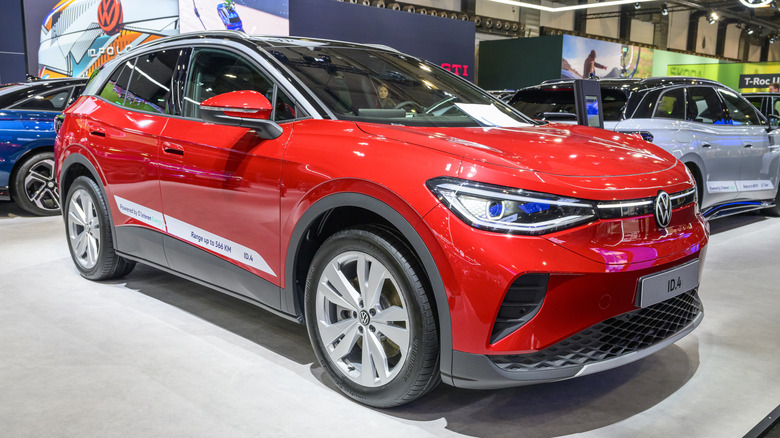 A red Volkswagen ID.4 full electric crossover SUV on display.
