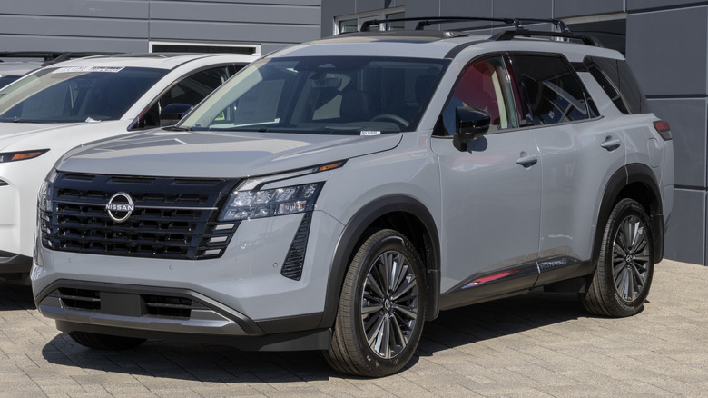 Nissan Pathfinder Platinum 4WD Mid-Size SUV at a dealership.