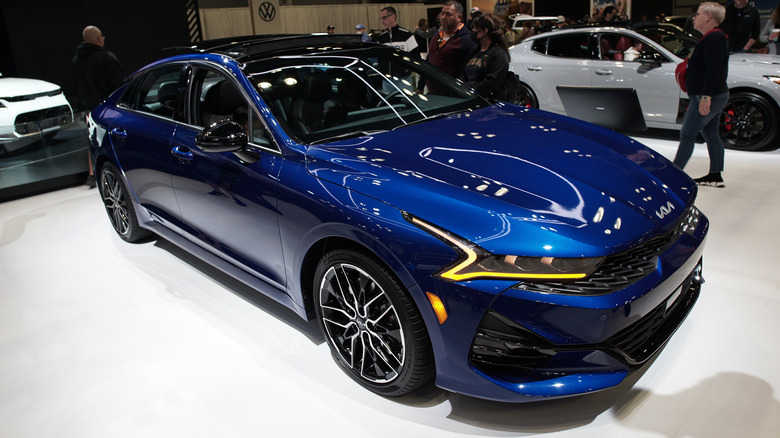 A blue 2022 Kia Forte on display at the New York Auto Show