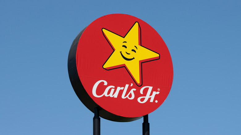 The logo of Carl's Jr. is seen outside one of its chain restaurants along an interstate highway in Portland, Oregon.