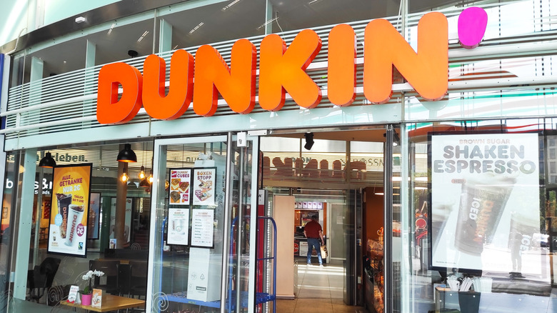 Dunkin' Donuts storefront at railway station.