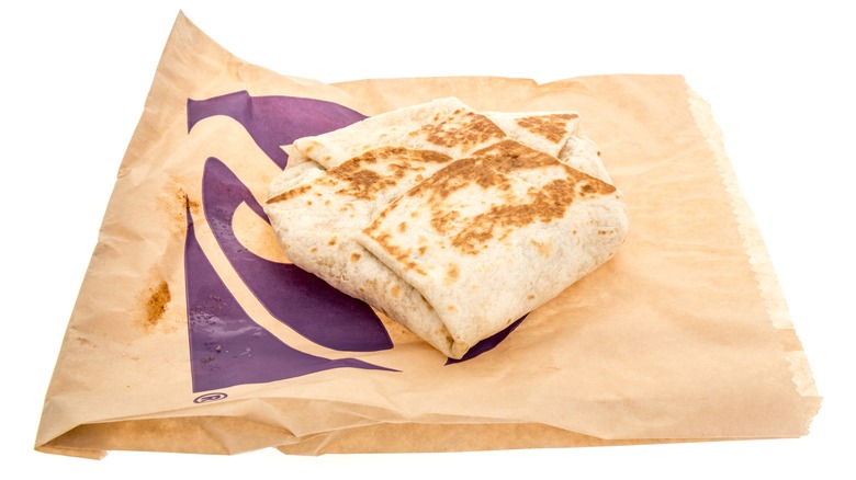 A package of Taco Bell breakfast crunchwrap on an isolated background.
