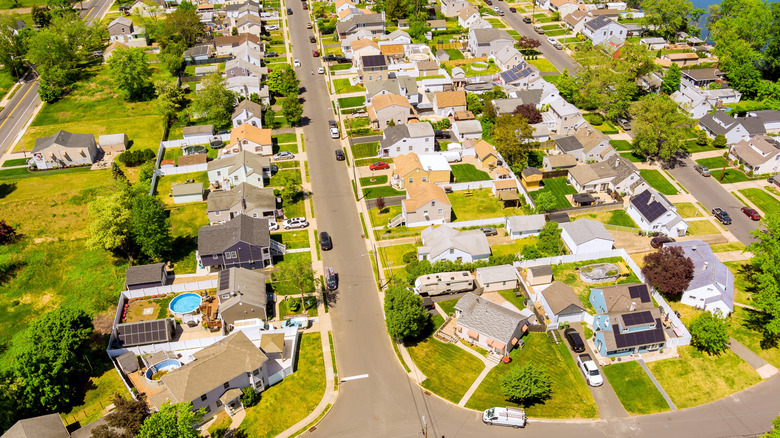 Overhead residential neighborhood with neat rows of houses, intersecting streets suburban landscape in Sayreville, Middlesex County, New Jersey.