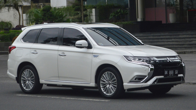 A white 2021 Mitsubishi Outlander Sport on the road.