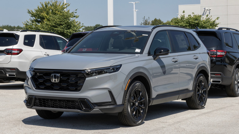 Gray Honda CR-V parked at dealership.