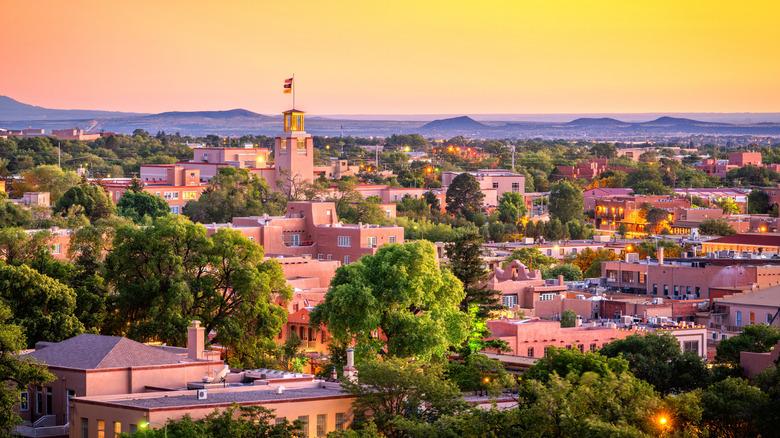 An aerial view of Santa Fe, New Mexico, USA downtown skyline at dusk.