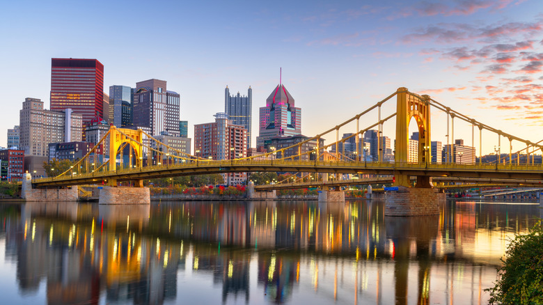 A view of Pittsburgh, Pennsylvania, USA downtown city skyline on the Ohio River at dusk.