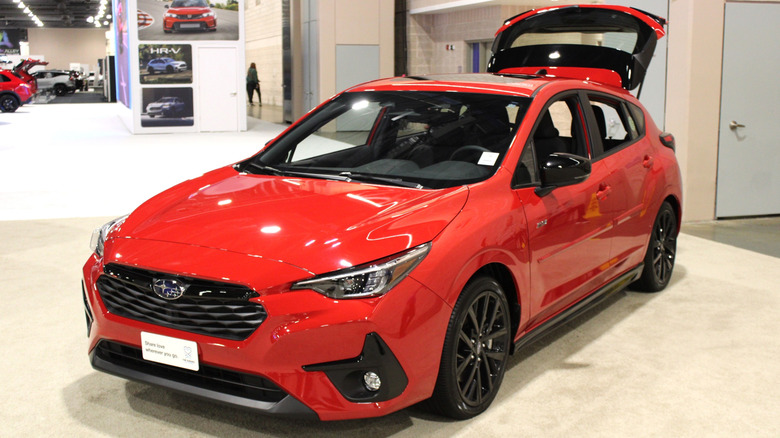 A red Subaru Impreza on display.