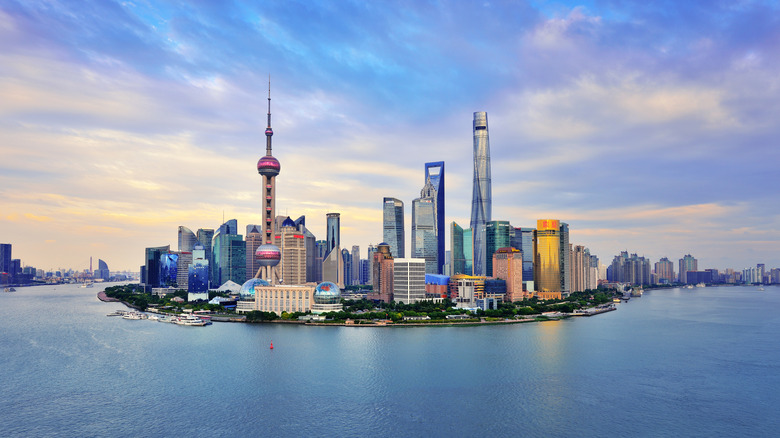 Shanghai skyline panoramic in the dramatic sky at sunset.