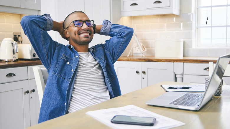 Man relaxing after paying bill