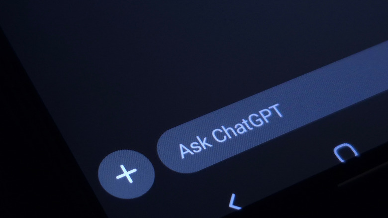 Phone screen displaying "ask Chatgpt"