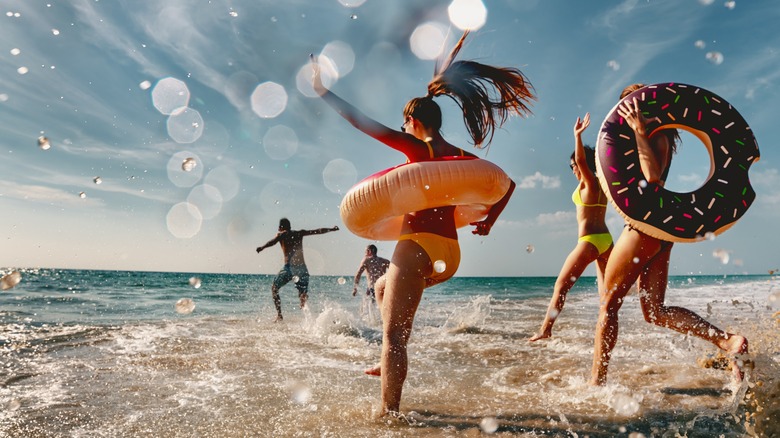 friends running on the beach