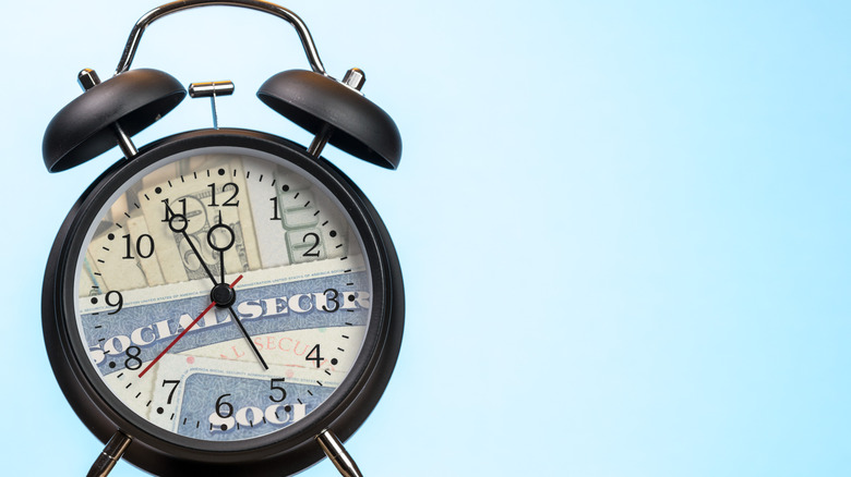clock with Social Security cards and money on the face