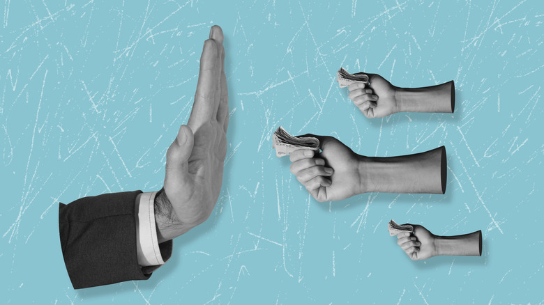 hand held up to indicate refusal