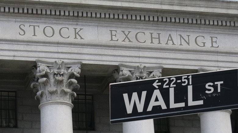 Photo of Wall Street street sign in front of the New York Stock Exchange
