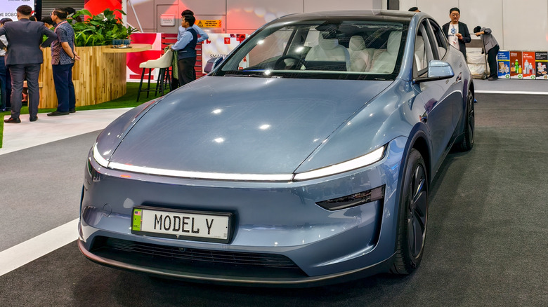 Tesla Model Y vehicle parked in a showroom