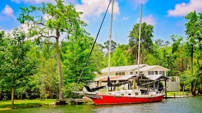 Sailboat docked on Magnolia River in Magnolia Springs, Alabama