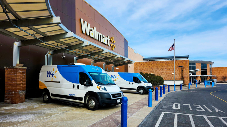 Walmart vans in front of a store