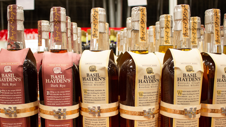 A display of Basil Hayden's whiskey bottles in a store.