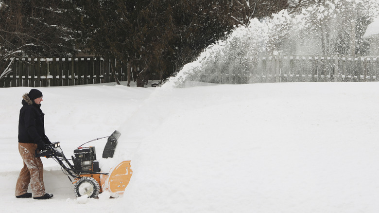 Person using a snow blower