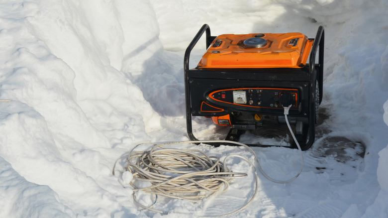 Portable generator being used in snow