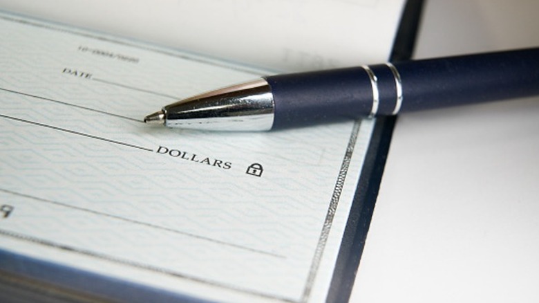 A pen set on top of a blank check