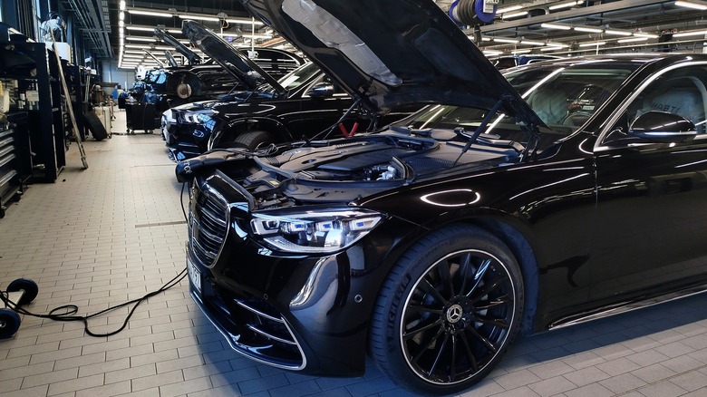 The hood is open for Mercedes-Benz repair work
