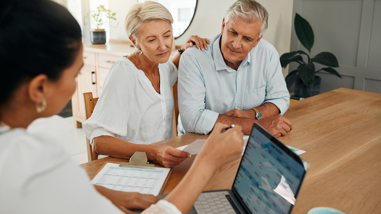Senior couple working with a financial advisor