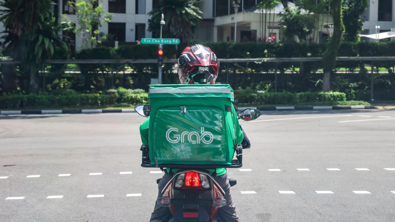 a food delivery driver on a scooter