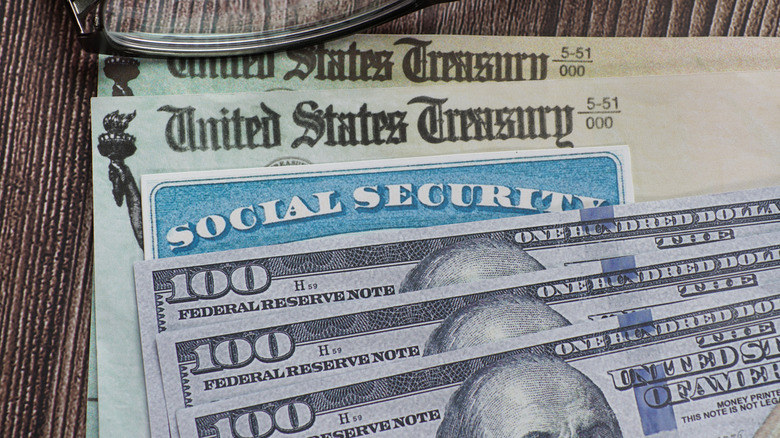 $100 bills and Social Security checks