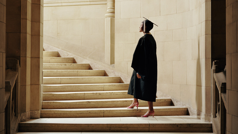 college graduate in an empty hall