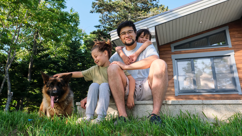 a family sitting on front porch