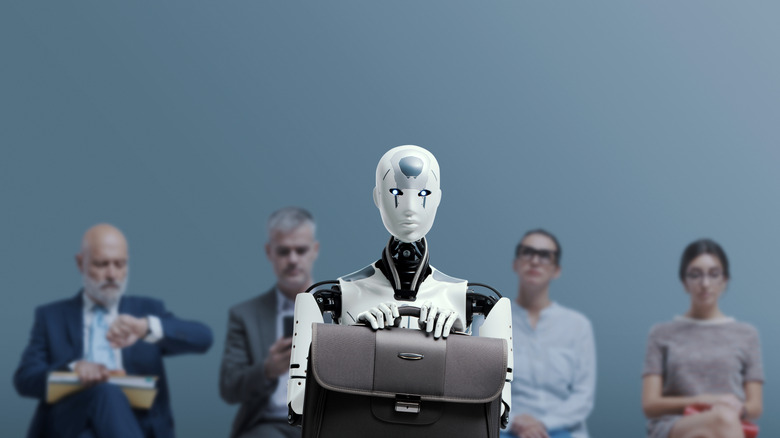 a robot and people waiting for an interview
