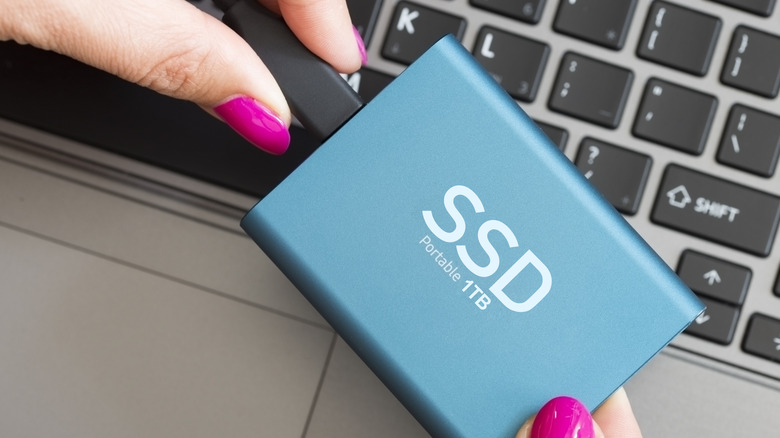 Portable SSD in woman's hands
