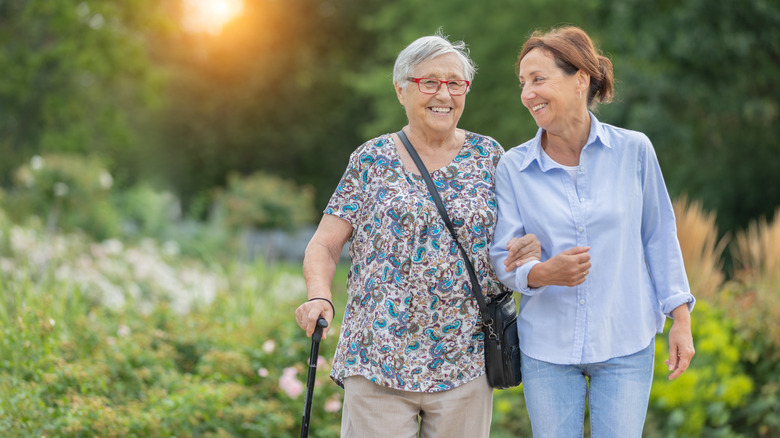 Senior woman walking with a female companion