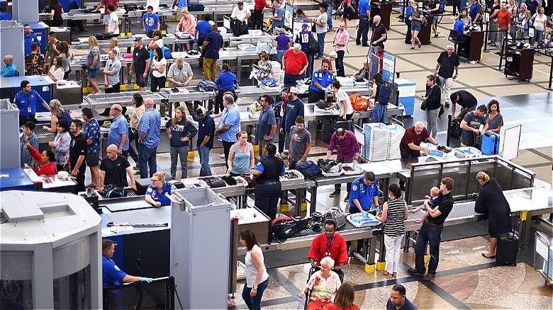 flyers gather at security checkpoint